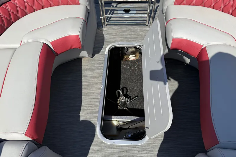 Slide: The Image of 2022 Bennington R 24 Quad Bench Bowrider with open storage compartment. - 22