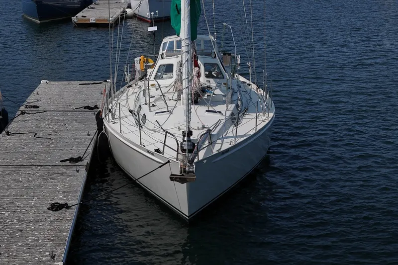 Slide: The Image of Sailing yacht Van De Stadt Samoa 47, 1993 model, docked at a marina. - 7