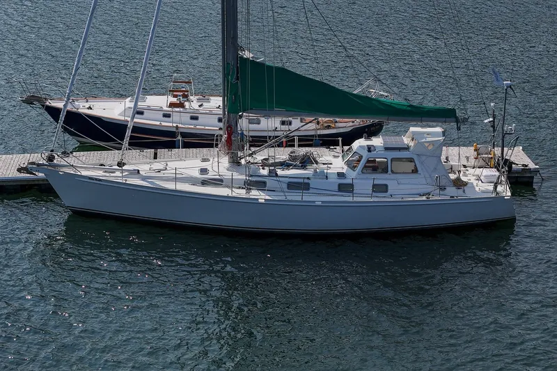 Slide: The Image of Sailing yacht Van De Stadt Samoa 47, 1993 model, docked at a marina. - 29