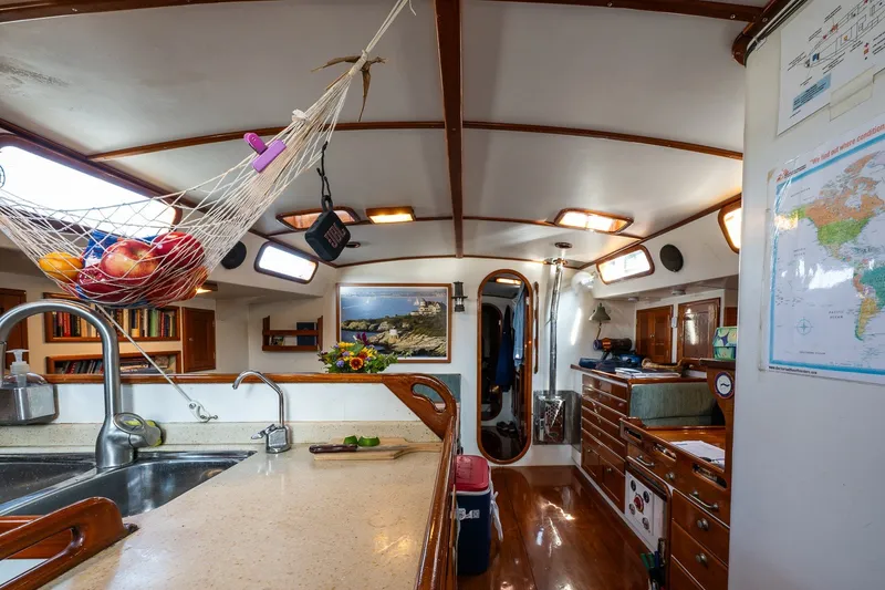 Slide: The Image of Interior of 1993 Van De Stadt Samoa 47 yacht with kitchen and fruit hammock. - 14