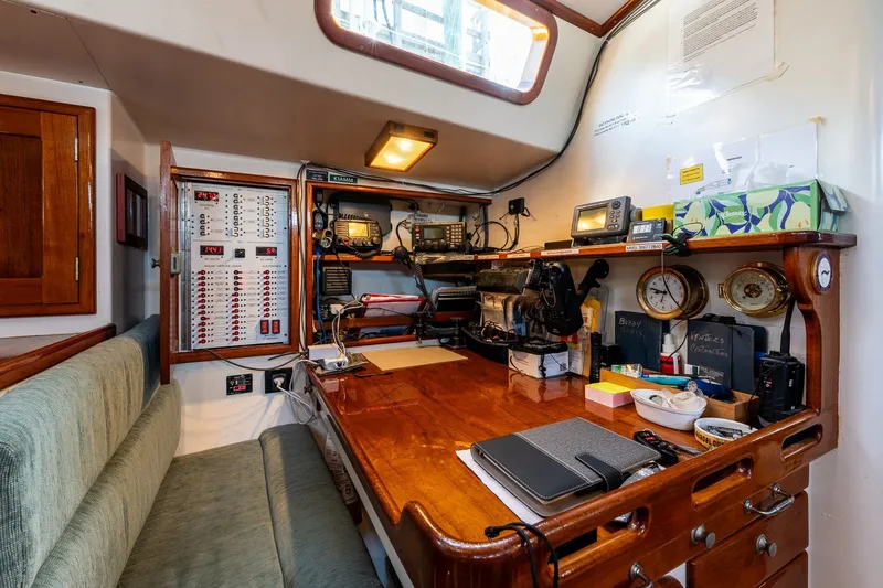 Slide: The Image of Navigation station inside a 1993 Van De Stadt Samoa 47 yacht, featuring equipment and controls. - 26