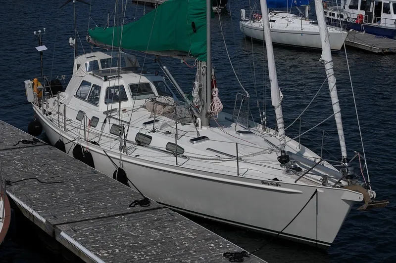 Slide: The Image of Sailing yacht Van De Stadt Samoa 47, 1993 model, docked at a marina. - 9