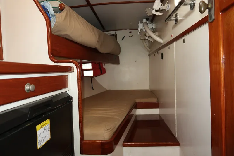 Slide: The Image of Interior of 1993 Van De Stadt Samoa 47 yacht with bunk beds and wooden cabinetry. - 19