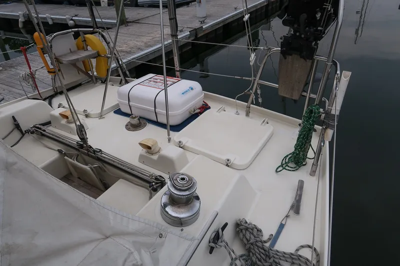 Slide: The Image of Deck view of 1993 Van De Stadt Samoa 47 sailboat at dock, featuring equipment and ropes. - 12