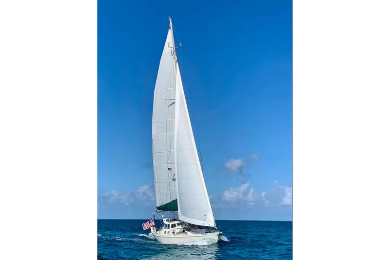 Slide: The Image of Sailing yacht Van De Stadt Samoa 47, 1993 model, cruising on open sea under clear blue sky. - 30