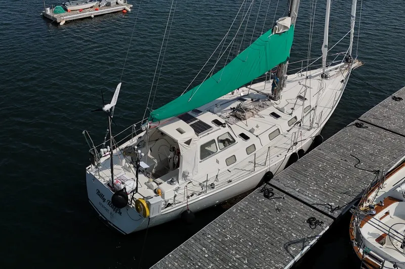 Slide: The Image of Samoa 47 sailboat by Van De Stadt, 1993 model, docked at a marina. - 3
