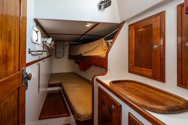 Slide: The Image of Cozy cabin interior of 1993 Van De Stadt Samoa 47 sailboat with wooden accents. - 17