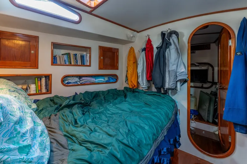 Slide: The Image of Cozy cabin interior of 1993 Van De Stadt Samoa 47 sailboat with bed and storage. - 27