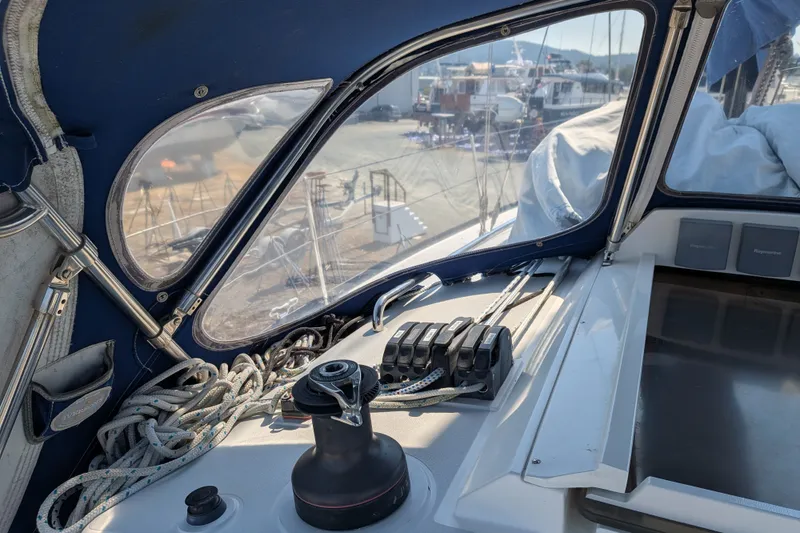 Slide: The Image of Cockpit view of a 2005 C&C 115 sailboat, featuring ropes and winch. - 22