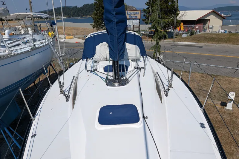 Slide: The Image of Sailboat C&C 115, 2005 model, docked near Anacortes Marina with scenic background. - 27