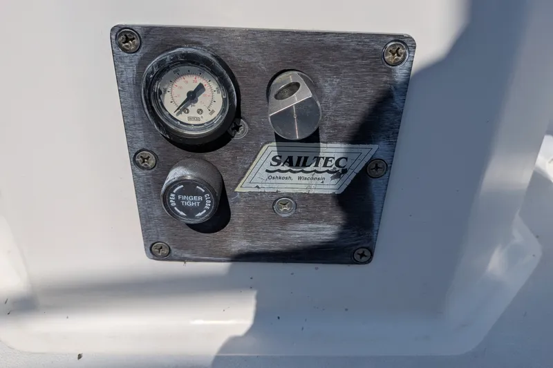 Slide: The Image of Control panel of a 2005 C&C 115 sailboat with Sailtec gauge and knob. - 16