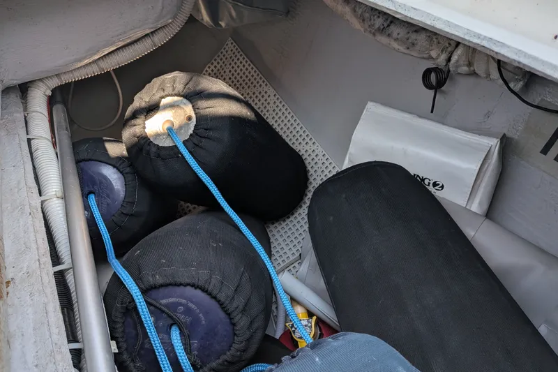 Slide: The Image of Storage compartment with boat fenders and ropes on a 2005 C&C 115 sailboat. - 18