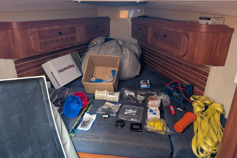 Slide: The Image of Interior of a 2005 C&C 115 sailboat with various tools and equipment. - 33