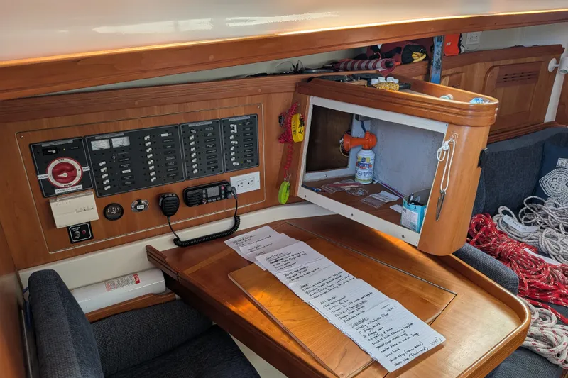 Slide: The Image of Interior of a 2005 C&C 115 sailboat with navigation panel and storage. - 37