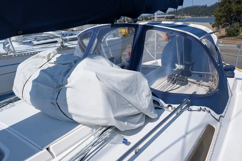 Slide: The Image of Sailboat cockpit with covered equipment, C&C 115 model, 2005, docked at marina. - 25