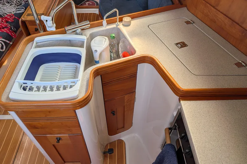 Slide: The Image of Compact kitchen area in a 2005 C&C 115 sailboat with sink and countertop. - 41