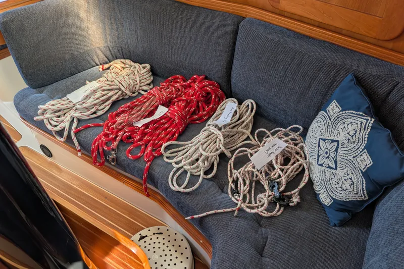 Slide: The Image of Coiled ropes on a C&C 115 sailboat's cushioned seating, 2005 model. - 39