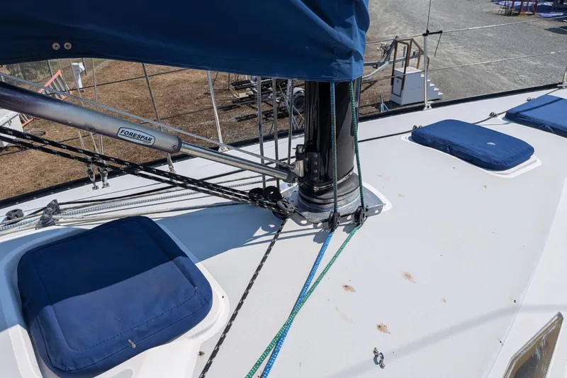 Slide: The Image of Deck of 2005 C&C 115 sailboat with rigging and blue covers. - 26
