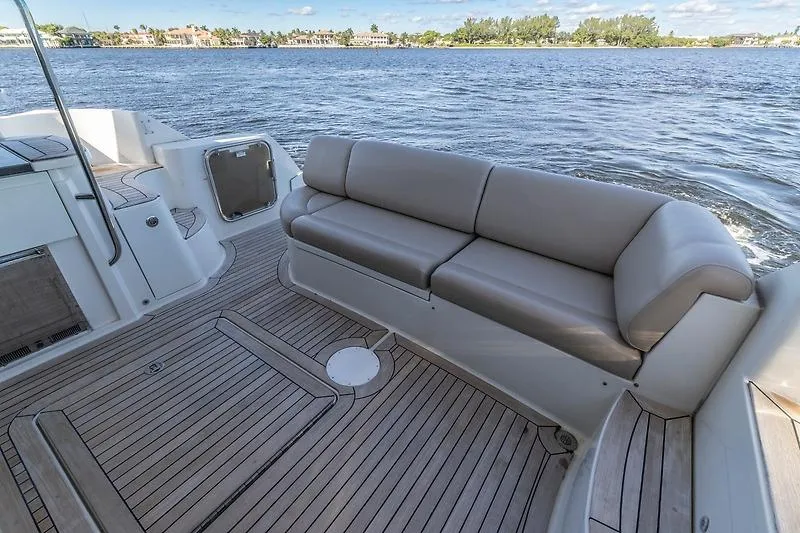 Slide: The Image of Luxurious 2016 Sea Ray 510 Fly yacht deck with comfortable seating and scenic water view. - 16