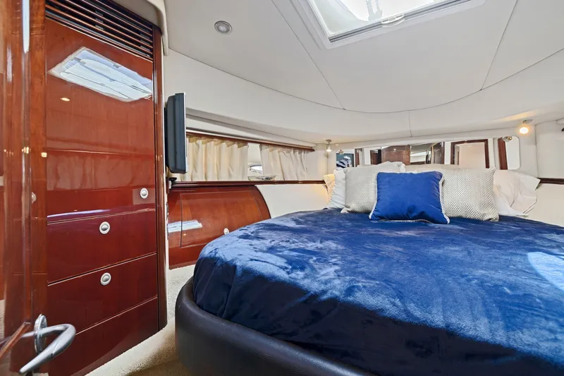 Slide: The Image of Luxurious bedroom interior of 2007 Sea Ray 58 Sedan Bridge yacht with plush bedding. - 52