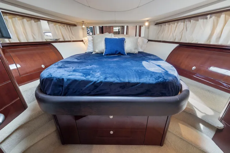 Slide: The Image of Luxurious bedroom interior of 2007 Sea Ray 58 Sedan Bridge yacht with plush bedding. - 50