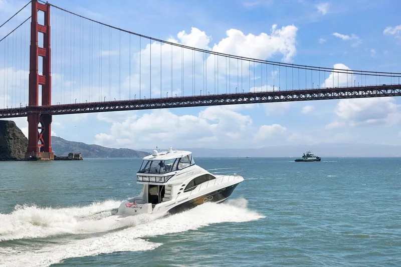 Slide: The Image of 2007 Sea Ray 58 Sedan Bridge yacht cruising near Golden Gate Bridge on a sunny day. - 4