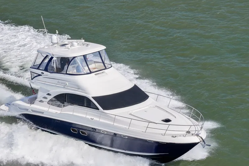 Slide: The Image of 2007 Sea Ray 58 Sedan Bridge yacht cruising on open water. - 7