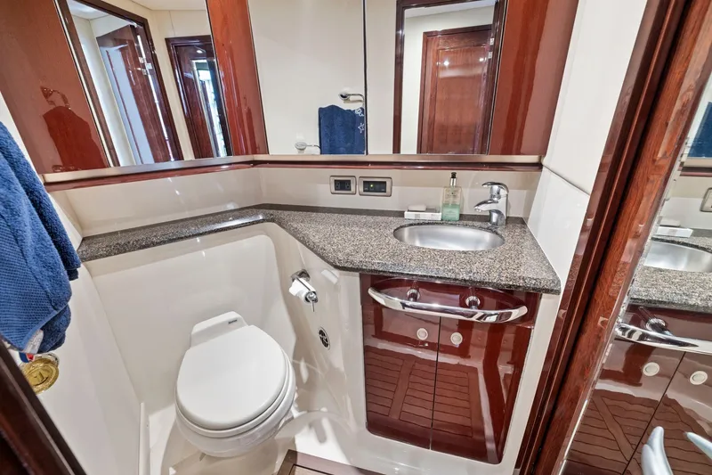 Slide: The Image of Luxurious bathroom in 2007 Sea Ray 58 Sedan Bridge yacht with granite countertop and modern fixtures. - 51