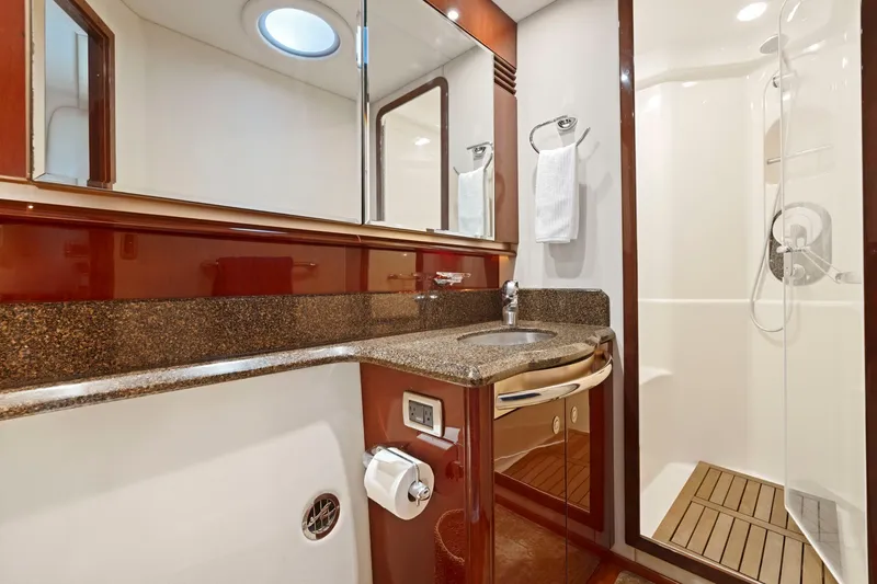 Slide: The Image of Luxurious bathroom in 2007 Sea Ray 58 Sedan Bridge yacht with granite countertop and shower. - 61
