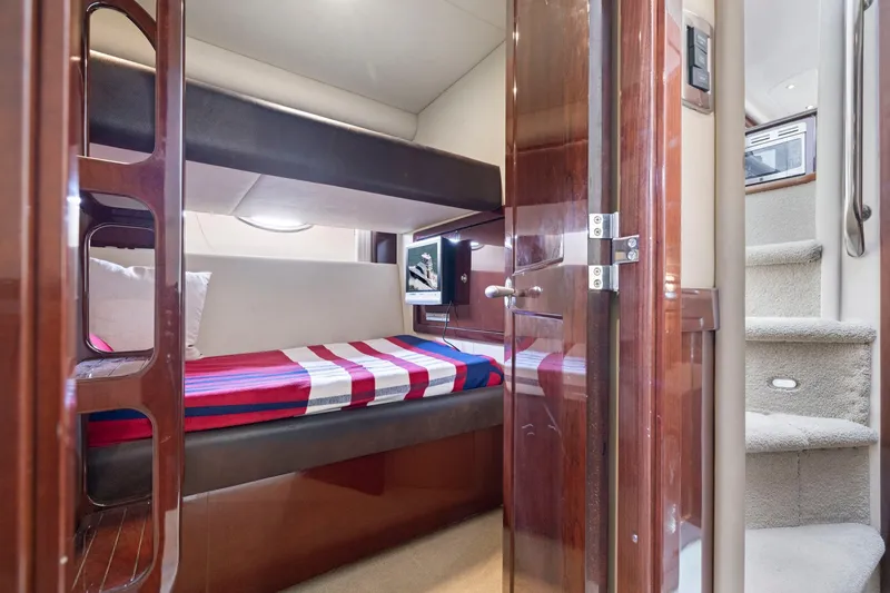 Slide: The Image of Interior of 2007 Sea Ray 58 Sedan Bridge with bunk beds and wooden finish. - 45