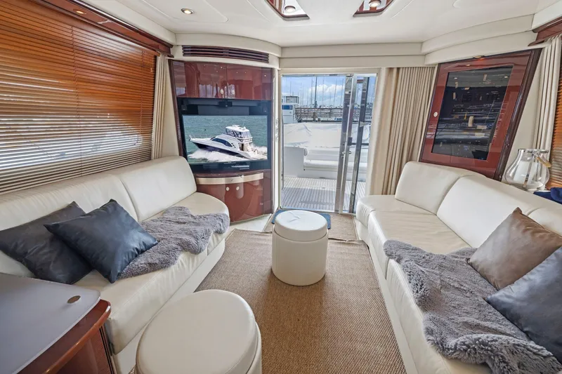 Slide: The Image of Luxurious interior of 2007 Sea Ray 58 Sedan Bridge yacht with plush seating and ocean view. - 37