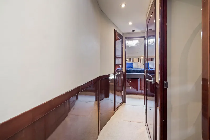 Slide: The Image of Luxurious hallway inside 2007 Sea Ray 58 Sedan Bridge yacht, featuring elegant wood finishes. - 43