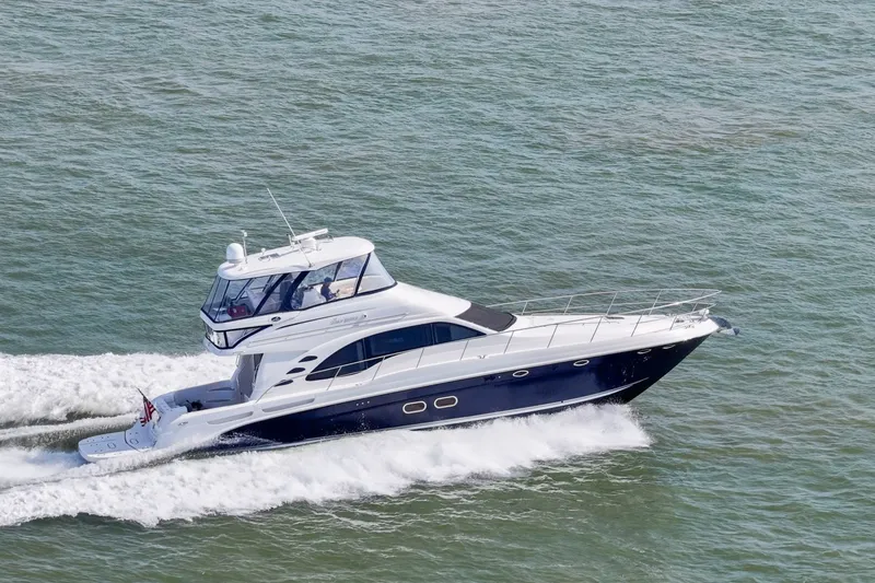 Slide: The Image of 2007 Sea Ray 58 Sedan Bridge yacht cruising on open water. - 6