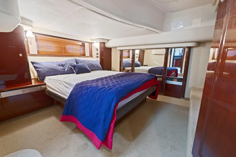 Slide: The Image of Luxurious bedroom interior of 2007 Sea Ray 58 Sedan Bridge yacht with elegant bedding. - 58