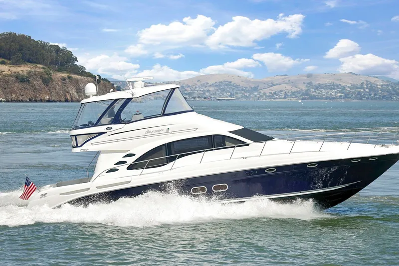 Slide: The Image of 2007 Sea Ray 58 Sedan Bridge yacht cruising on scenic waters. - 1