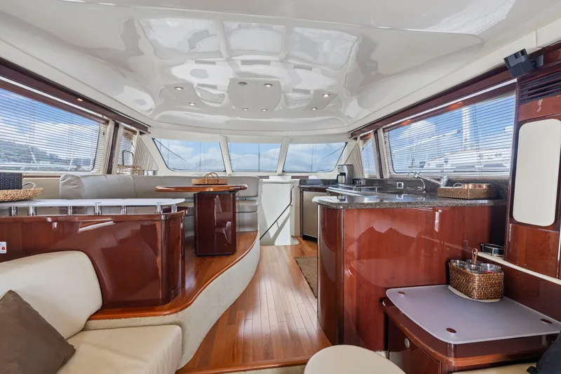 Slide: The Image of Luxurious interior of a 2007 Sea Ray 58 Sedan Bridge yacht with elegant wood finishes. - 34