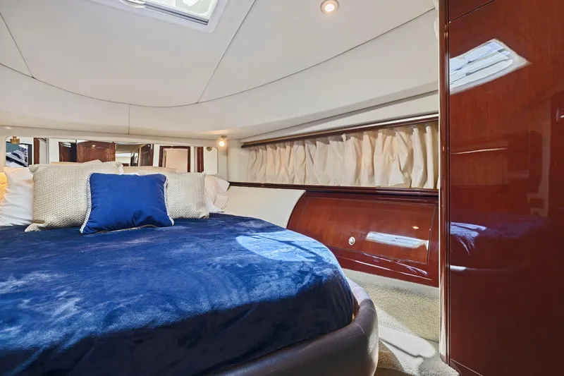 Slide: The Image of Luxurious cabin interior of 2007 Sea Ray 58 Sedan Bridge yacht with plush bedding. - 53
