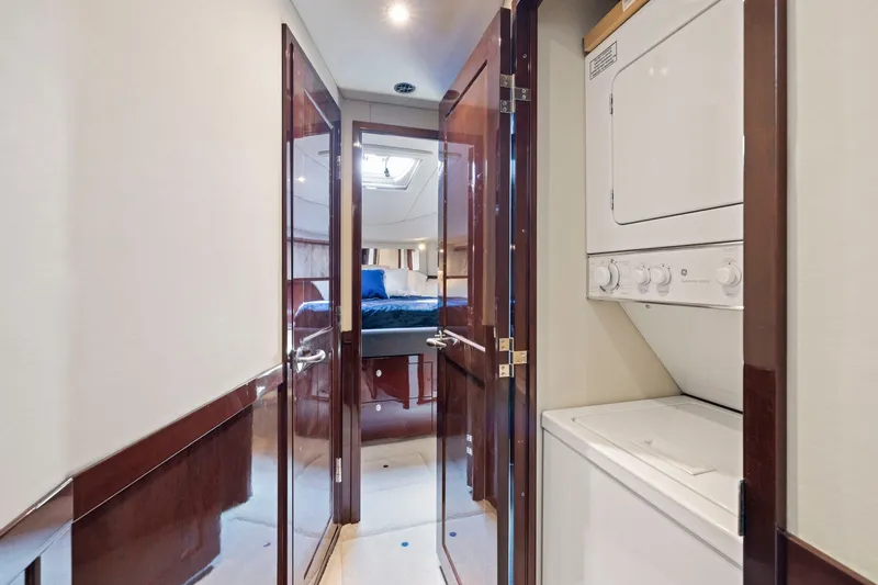 Slide: The Image of 2007 Sea Ray 58 Sedan Bridge interior with laundry area and bedroom view. - 48
