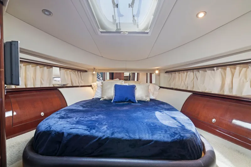 Slide: The Image of Luxurious bedroom interior of 2007 Sea Ray 58 Sedan Bridge yacht. - 49