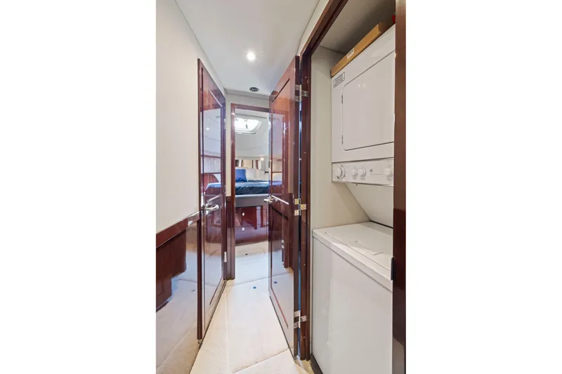 Slide: The Image of 2007 Sea Ray 58 Sedan Bridge interior with laundry area and bedroom view. - 47