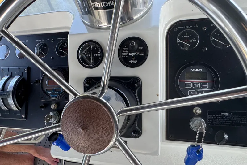 Slide: The Image of Helm of 1990 Carver 3807 Aft Cabin Motor Yacht with gauges and controls. - 37