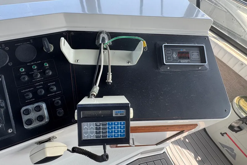 Slide: The Image of Control panel of a 1990 Carver 3807 Aft Cabin Motor Yacht with navigation equipment. - 38