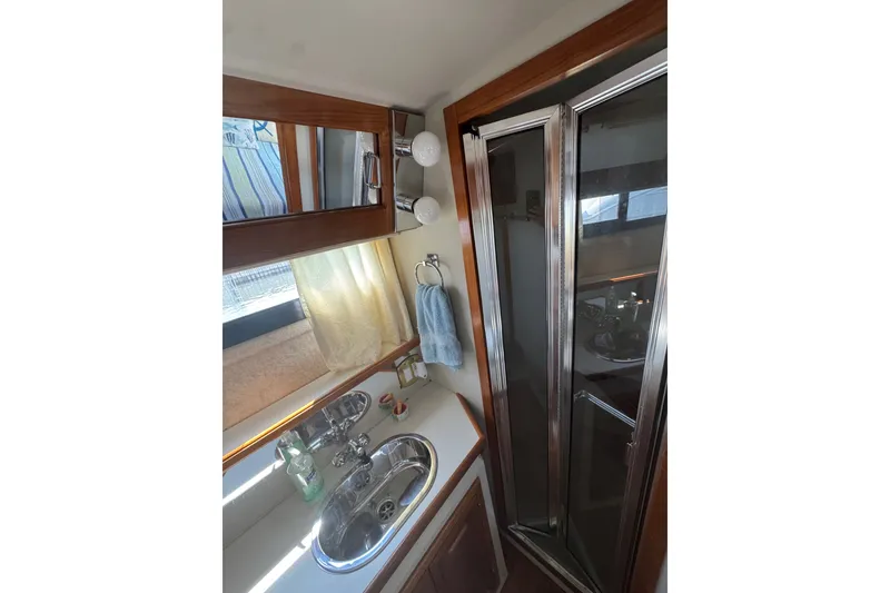 Slide: The Image of Bathroom interior of 1990 Carver 3807 Aft Cabin Motor Yacht with sink and shower. - 30