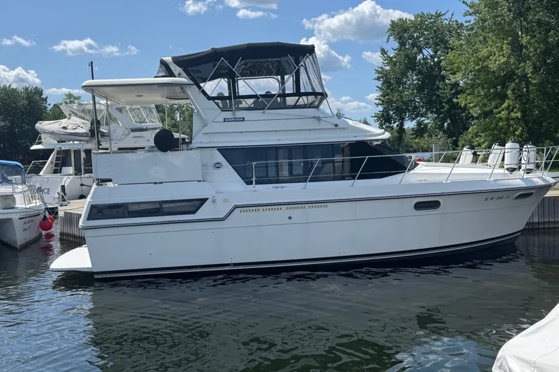 The Image of 1990 Carver 3807 Aft Cabin Motor Yacht docked on a sunny day. - 0