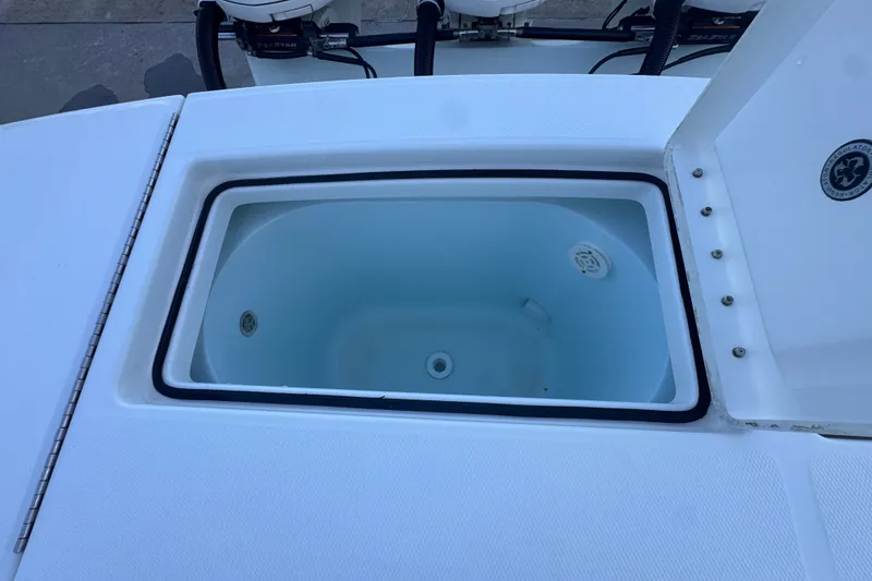 Slide: The Image of Open storage compartment on a 2016 Regulator 34 boat, showcasing interior details. - 21