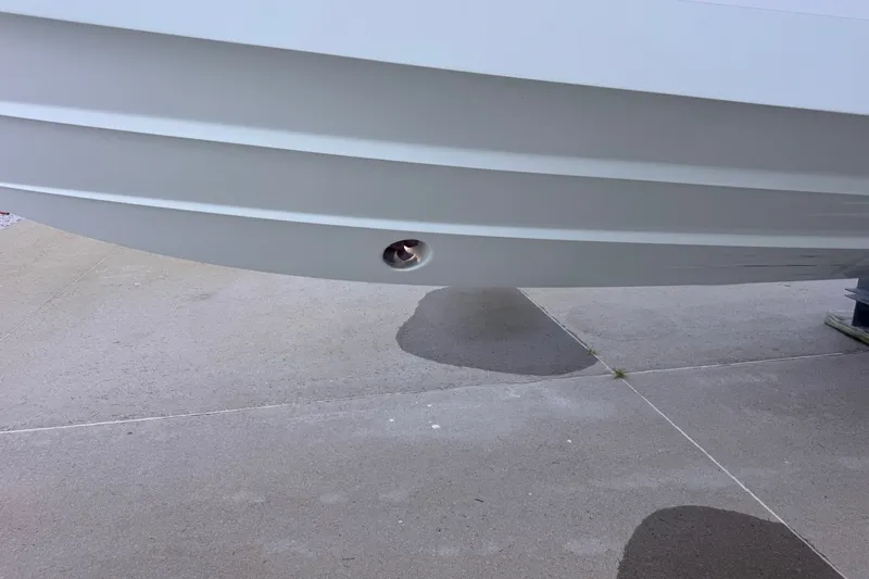 Slide: The Image of 2016 Regulator 34 boat hull on concrete surface, showcasing sleek design. - 28