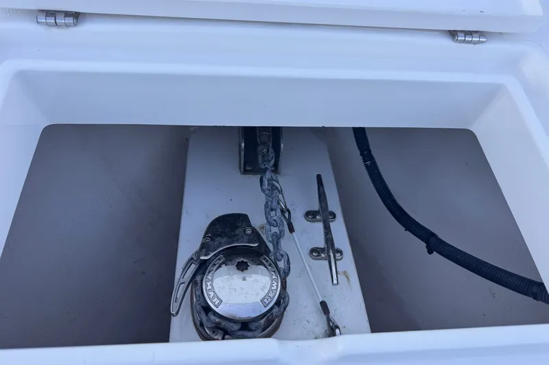 Slide: The Image of Anchor locker of a 2016 Regulator 34 boat with chain and cleat. - 25