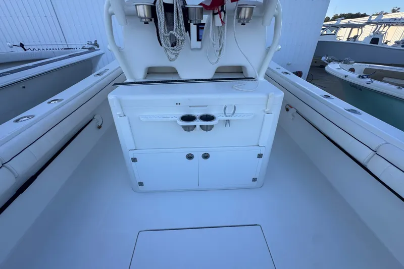 Slide: The Image of 2016 Regulator 34 boat interior with storage and cup holders. - 17