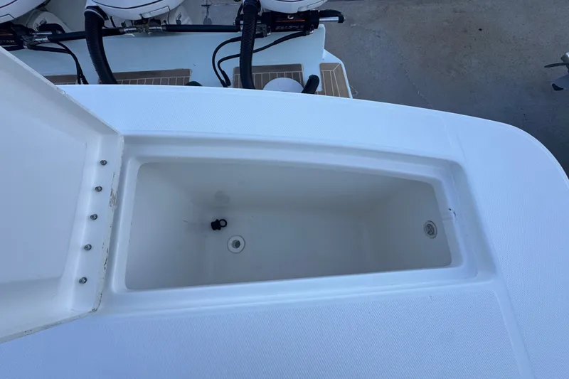 Slide: The Image of Open storage compartment on a 2016 Regulator 34 boat, showcasing interior space. - 22