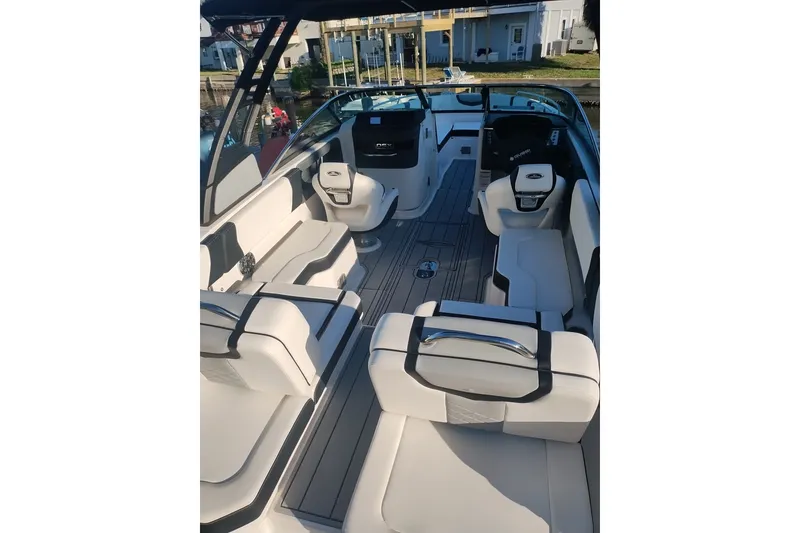 Slide: The Image of 2024 Chaparral 250 OSX boat interior with sleek seating and modern design. - 14